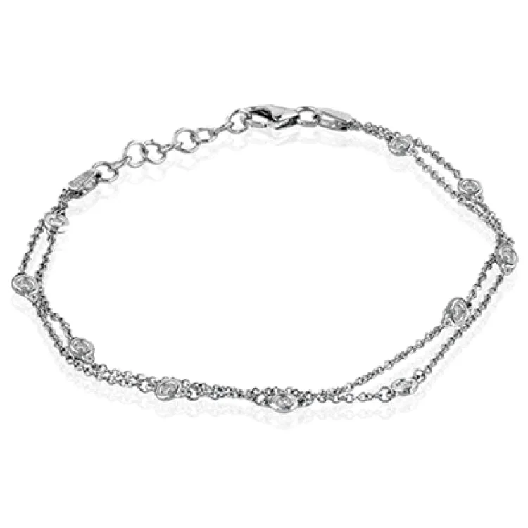 Women’s gold-plated bracelets-This classic bracelet is sure to become a favorite with .24 ctw of white diamonds shining amidst 18k white gold chains.