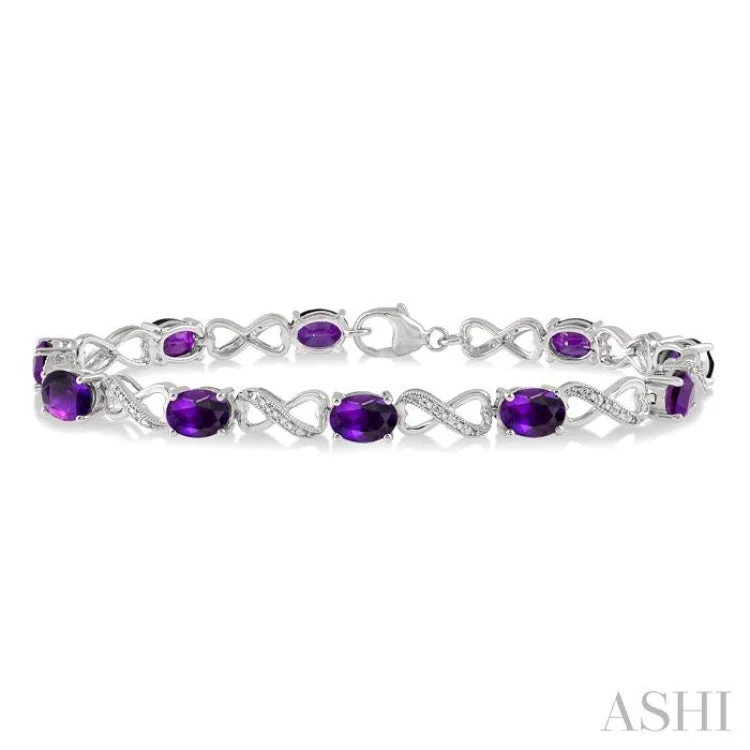 Women’s minimalist bracelets-1/10 ctw Round Cut Diamond & 7x5MM Oval Cut Amethyst Semi Precious Infinity Bracelet in Silver