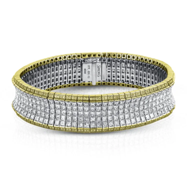 Women’s wedding bangle sets-This dazzling contemporary white gold bracelet is set with 1.15 ctw of glistening round white diamonds and 19.48 ctw of princess cut diamonds.