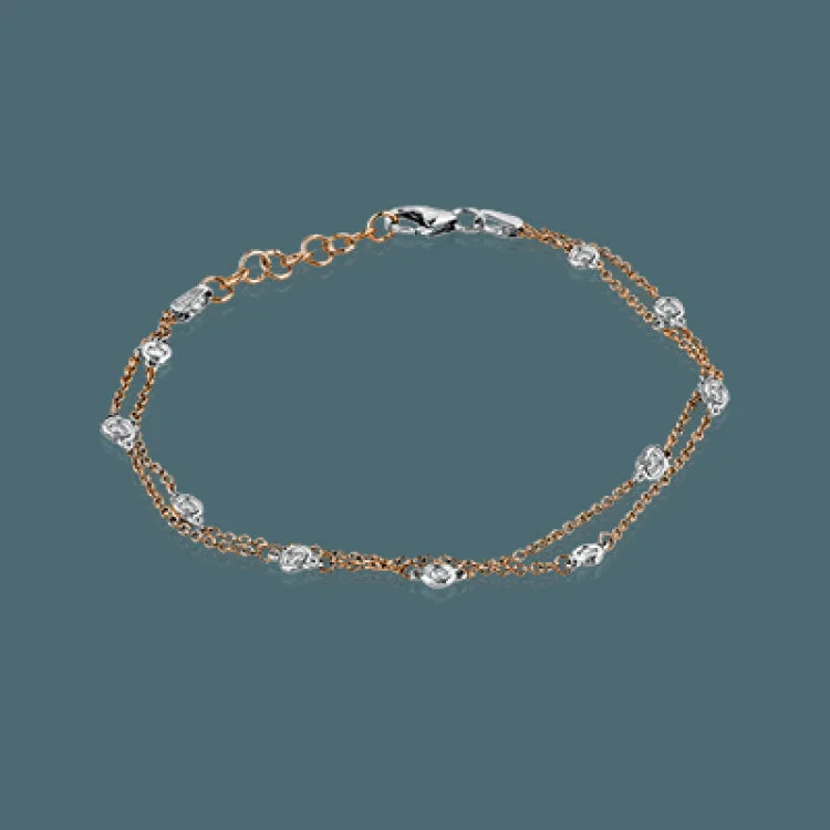 Women’s rose gold bracelets-This classic bracelet is sure to become a favorite with .24 ctw of white diamonds shining amidst 18k white gold chains.