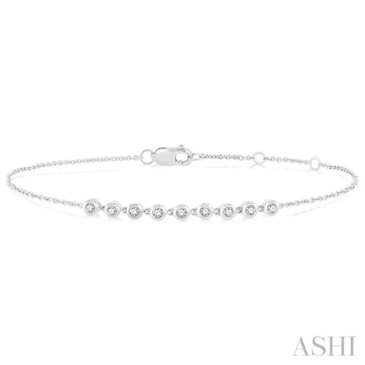 Women’s custom bracelets-1/5 ctw Bezel Round Cut Diamond Petite Bracelet in 10K White Gold