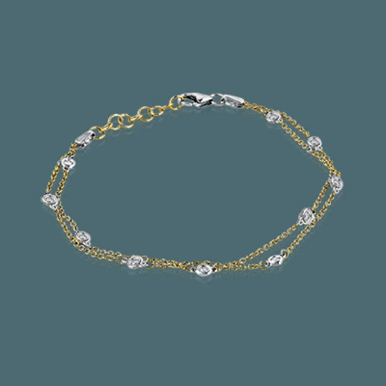 Women’s minimalist bangles-This classic bracelet is sure to become a favorite with .24 ctw of white diamonds shining amidst 18k white gold chains.