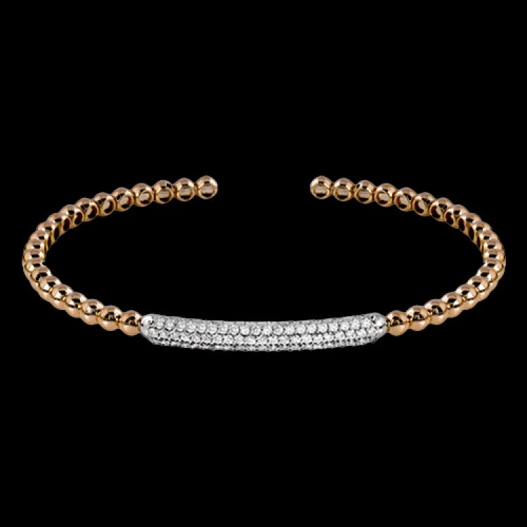 Women’s engraved charm bracelets-This bangle bracelet is wonderful to pair with other bracelets, but also stands on its own. 18k rose gold provides a warm background for .52 ctw of white diamonds. Perfect for stacking.