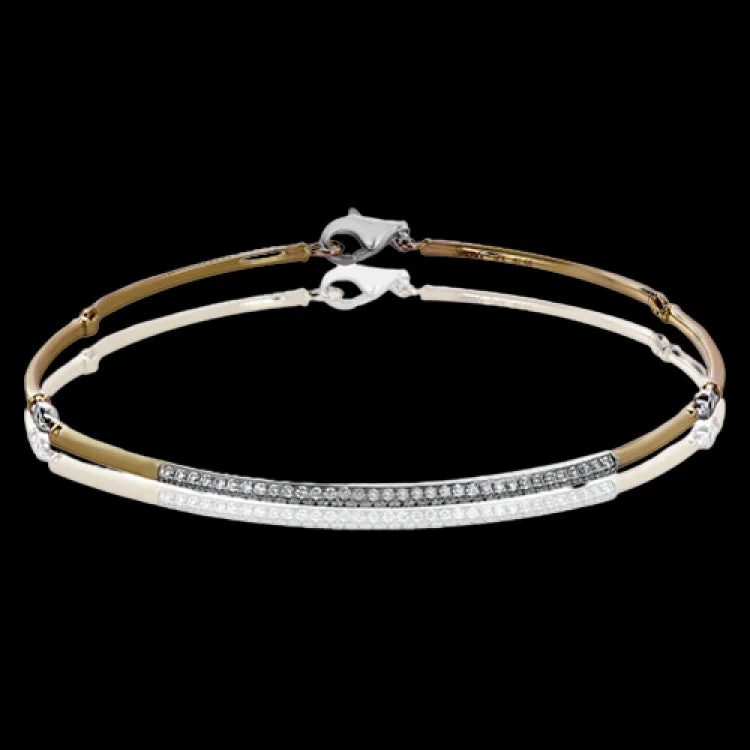 Women’s infinity bangles-This delicate bracelet is the perfect way to add some sparkle to every day with .50 ctw of white diamonds.