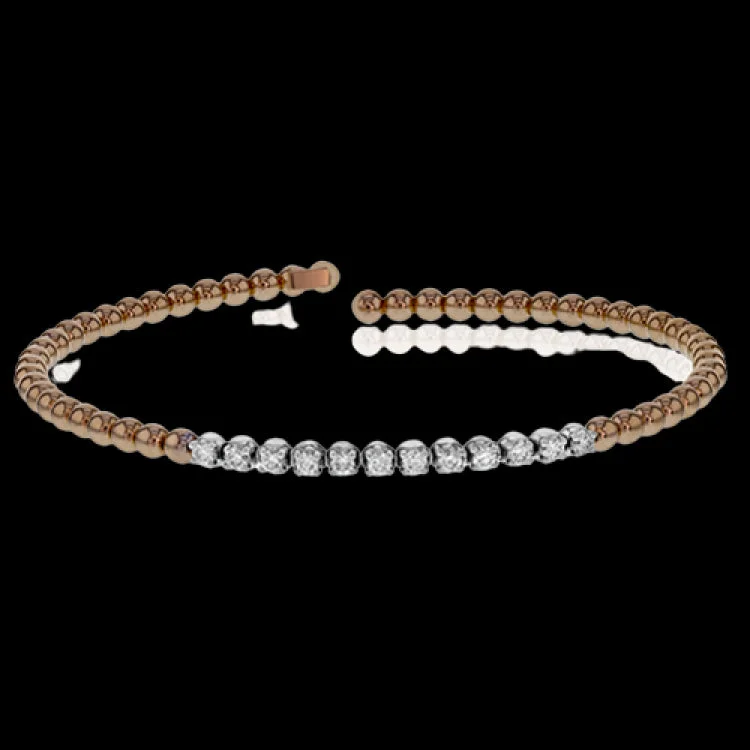 Women’s handcuff bracelets-This 18k rose gold bangle bracelet is perfect for stacking with .40 ctw of shining white round brilliant diamonds.