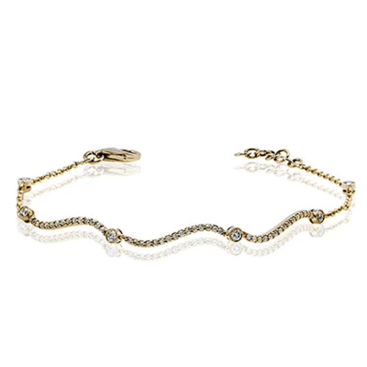 Women’s pearl bracelets-This curving gold bracelet is incredibly comfortable to wear due to its flexible design that sparkles with .50 ctw of white diamonds.