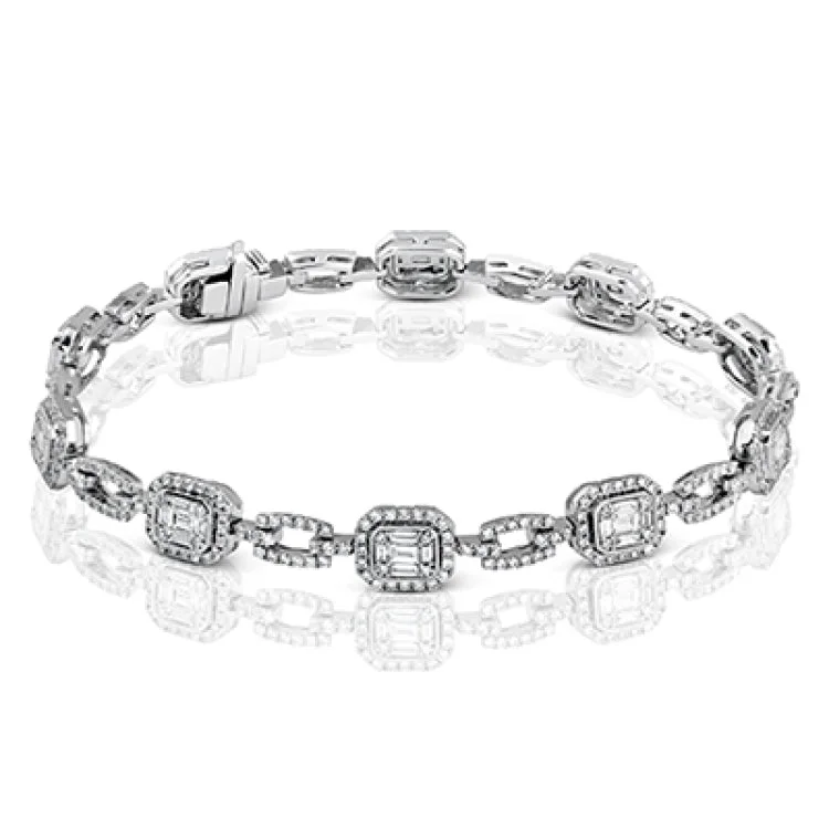 Women’s classic bangles-This gorgeous bracelet incorporates 2.07 ctw of round diamonds and 1.25 ctw of baguette diamonds into Mosaic designs which give a lovely, vintage appeal to this 18k white gold piece.