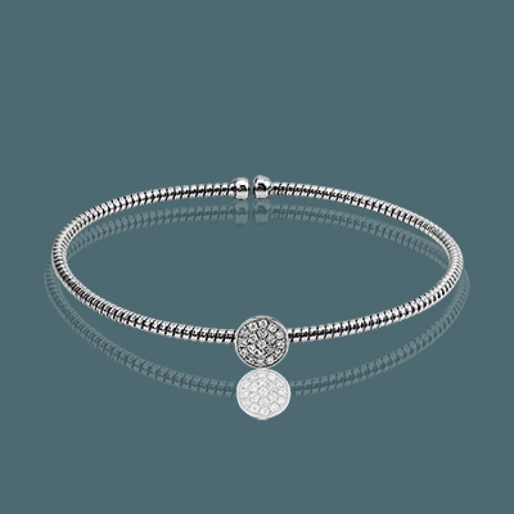 Women’s engraved charm bracelets-This dazzling modern white gold bangle bracelet is accentuated by an open design and highlighted with a lovely oval setting complemented with .15 ctw round cut white diamonds.