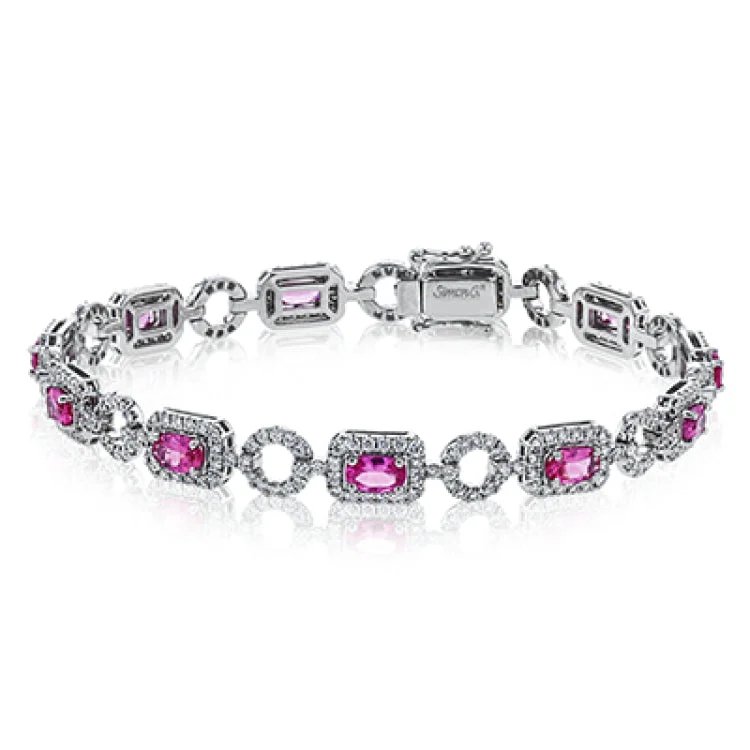 Women’s infinity bracelets-This elegant diamond and gemstone bracelet features 2.83 ctw of pink spinel and 1.93 ctw of white diamonds, set in 18K white gold