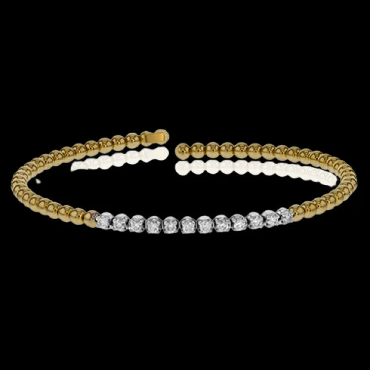 Women’s lucky bracelets-This 18k yellow gold bangle bracelet is perfect for stacking with .41 ctw of shining white round brilliant diamonds.