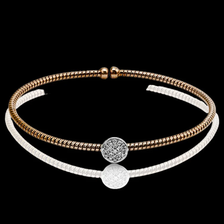 Women’s matching gold bangles-This brilliant contemporary white and rose gold bangle bracelet is highlighted by an open design set with an arresting oval setting accentuated with .15 ctw round cut white diamonds. Perfect for stacking.